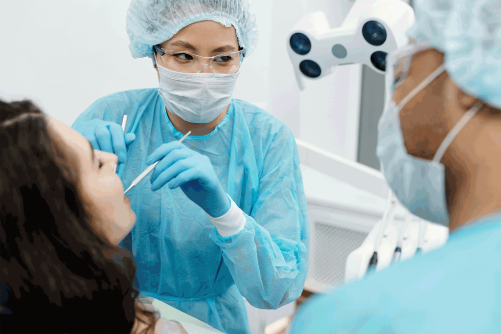 A dentist and her assistant working together on a patient at Victor Crescent Dental Clinic in Narre Warren, delivering expert dental care with precision and teamwork.