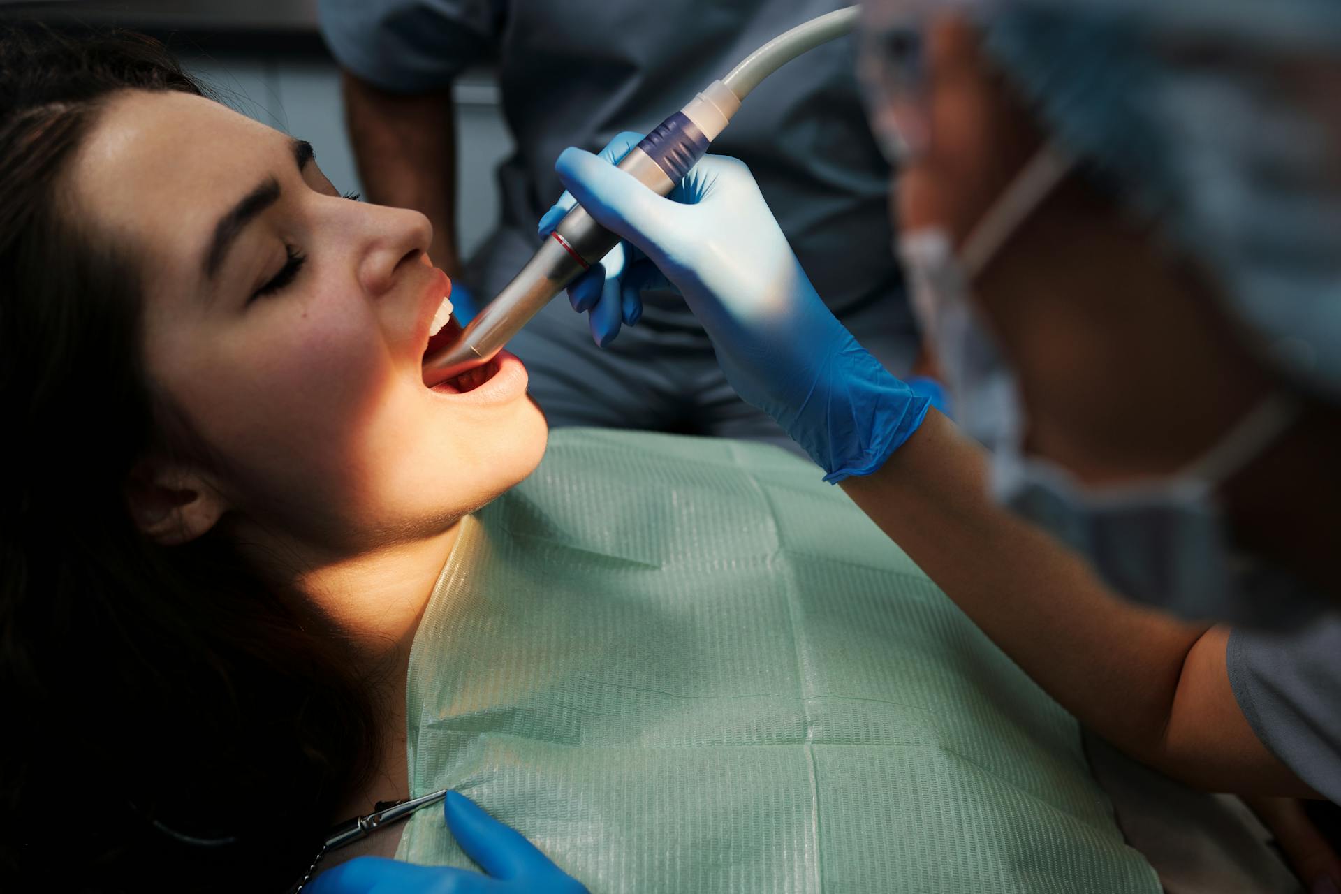 A dental professional performing a procedure on a patient at Victor Crescent Dental Clinic in Narre Warren, delivering expert care with advanced equipment and a gentle approach.