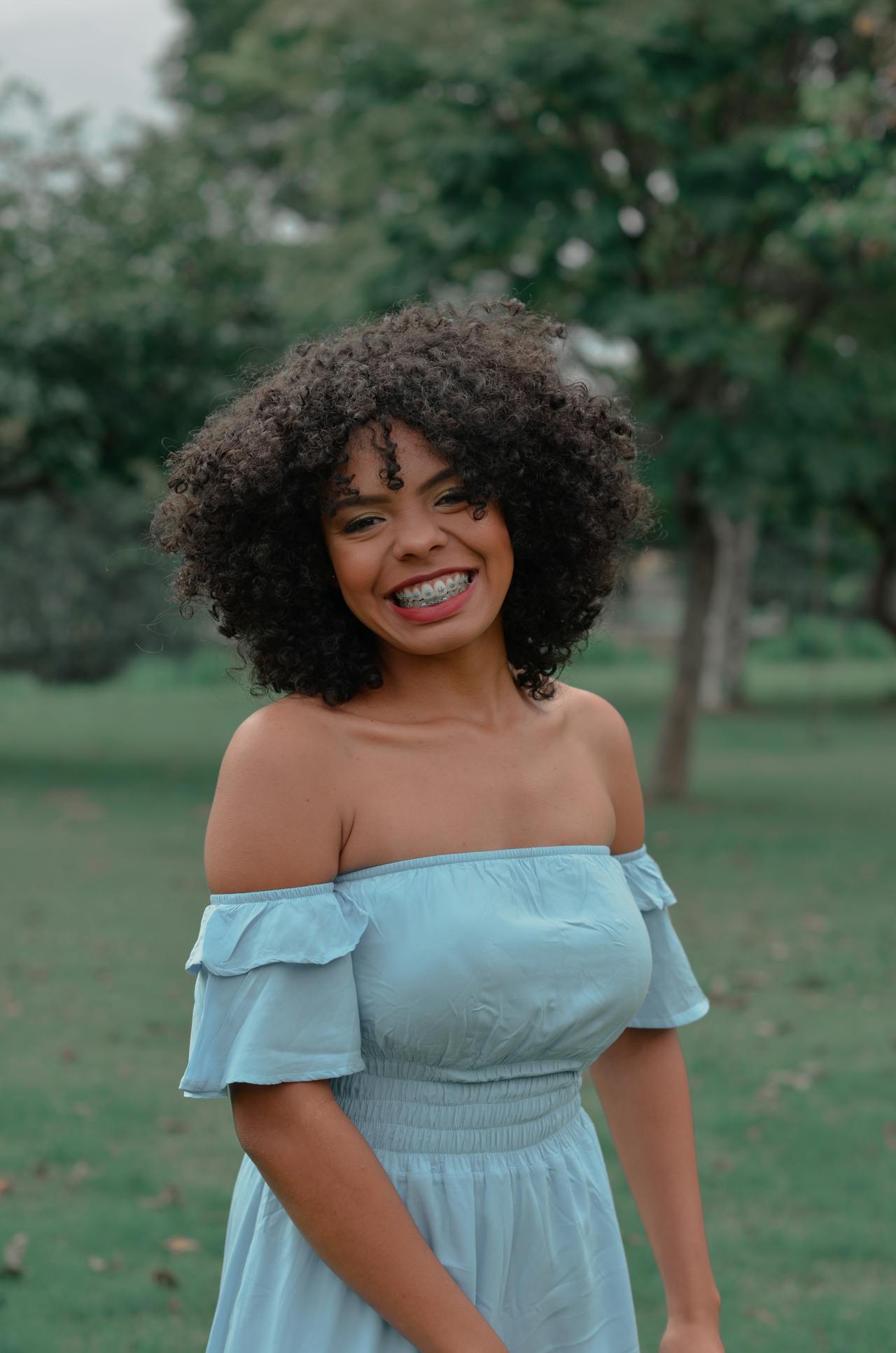 girl wearing braces smiling at a dentist near Narre Warren