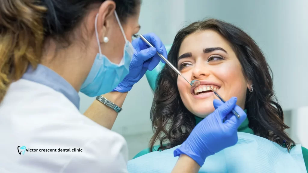 Gentle dentist near Narre Warren examining a smiling patient for gum disease or dental check-up
