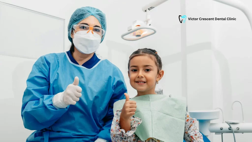 A friendly Narre Warren Dentist and a young patient giving a thumbs-up to signify trust and clarity on dental facts